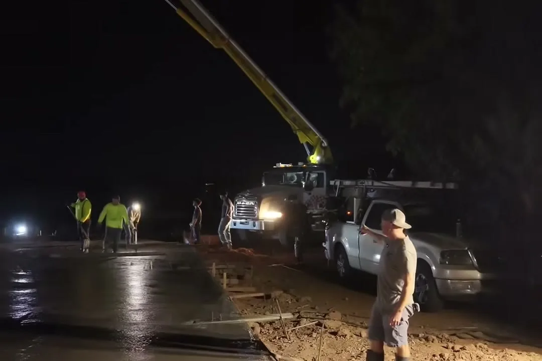 Pre-dawn concrete pour with a pump truck on a DC Construction and Development job in the East Valley